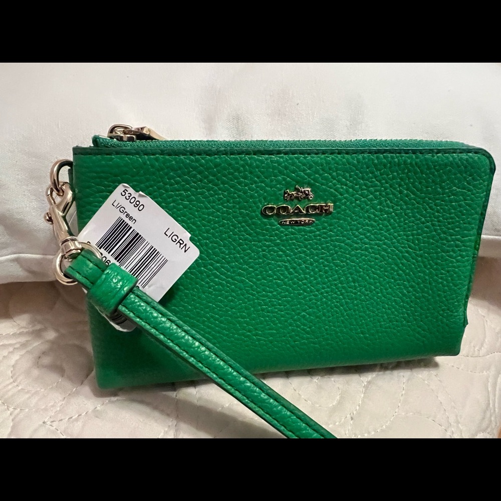 Coach small double zipper wristlet.